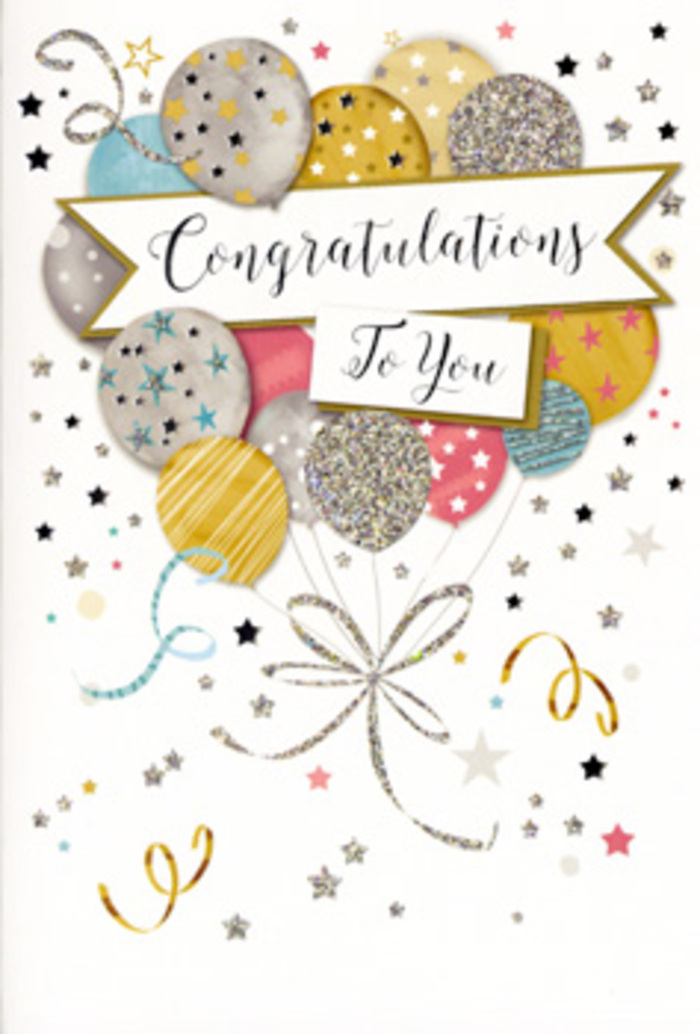 This congratulations card is depicted standing open enough for its front to catch the eye, as though it has just been set down beside a vase of fresh blooms in a Blackheath kitchen filled with natural light. The artwork centres on a lush spray of illustrated balloons, clustered together like a festive bouquet, in softly glowing tones of gold, silver, champagne, pale blue, blush pink, and muted grey. Each balloon is meticulously detailed: some feature tiny metallic stars that sparkle across their surface; others are ringed with glittery bands or dappled with fine confetti-like dots, implying rich texture and, in reality, a subtle raised feel beneath the fingertips. The balloon strings are rendered as slender, sweeping lines in gold and silver, curling downwards and crossing over one another in an elegant knot, reminiscent of the satin ribbons a local florist might use when tying a celebratory arrangement for a family in the village. Floating all around this central cluster, there is a soft scatter of miniature stars, dots, and ribbon swirls, gently spiralling against a pale, almost creamy background that keeps the overall effect light and airy. Across the middle of the design, a graceful banner arcs in a slight curve, framed with understated metallic edging and bearing the words Congratulations To You in refined cursive script that feels both classic and heartfelt. The composition conveys composure as much as joy, evoking proud moments such as exam successes, promotions in nearby Canary Wharf, or personal milestones shared with friends on the heath. It is the sort of card chosen when you want your message to feel thoughtful, elegant, and lasting, complementing the gift of flowers with a sense of glittering, quietly sophisticated celebration.