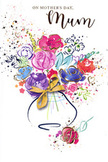 This Mother's Day card shows a vibrant, painterly bouquet that looks as if it has just been gathered from a spring garden in Blackheath and transformed into watercolour. A cluster of blossoms in lush purples, bright cerise, hot pink and gentle blue burst upwards from a rounded vase, each flower suggested by loose, overlapping brushstrokes that give a feeling of movement and life. Deep indigo outlines define some petals and leaves, while others dissolve into soft washes of lavender, apricot and rose, mirroring the kind of colour play seen in hand-tied bouquets prepared for local delivery. Fine threads of metallic gold dance over the petals, tracing their shapes like sunlight glinting off freshly cut stems in a flower studio near Blackheath High Street. Around the arrangement, scattered specks of colour and small heart motifs drift across a clean white background, creating the impression of petals tossed in celebration and affectionate whispers shared on a bench by the Heath. The vase is simple and understated, brushed in cool tones and adorned with a small golden bow that echoes the feel of satin ribbon tied snugly around a finished bouquet. The composition feels airy yet intentional, balancing bold colour with tender details, and it carries an emotional warmth that speaks to the close bond between mother and child. It is easy to imagine this image chosen by someone living near the station or on a quiet residential street, hoping to send comfort, joy and sincere thanks to a much-loved mum on Mother's Day.